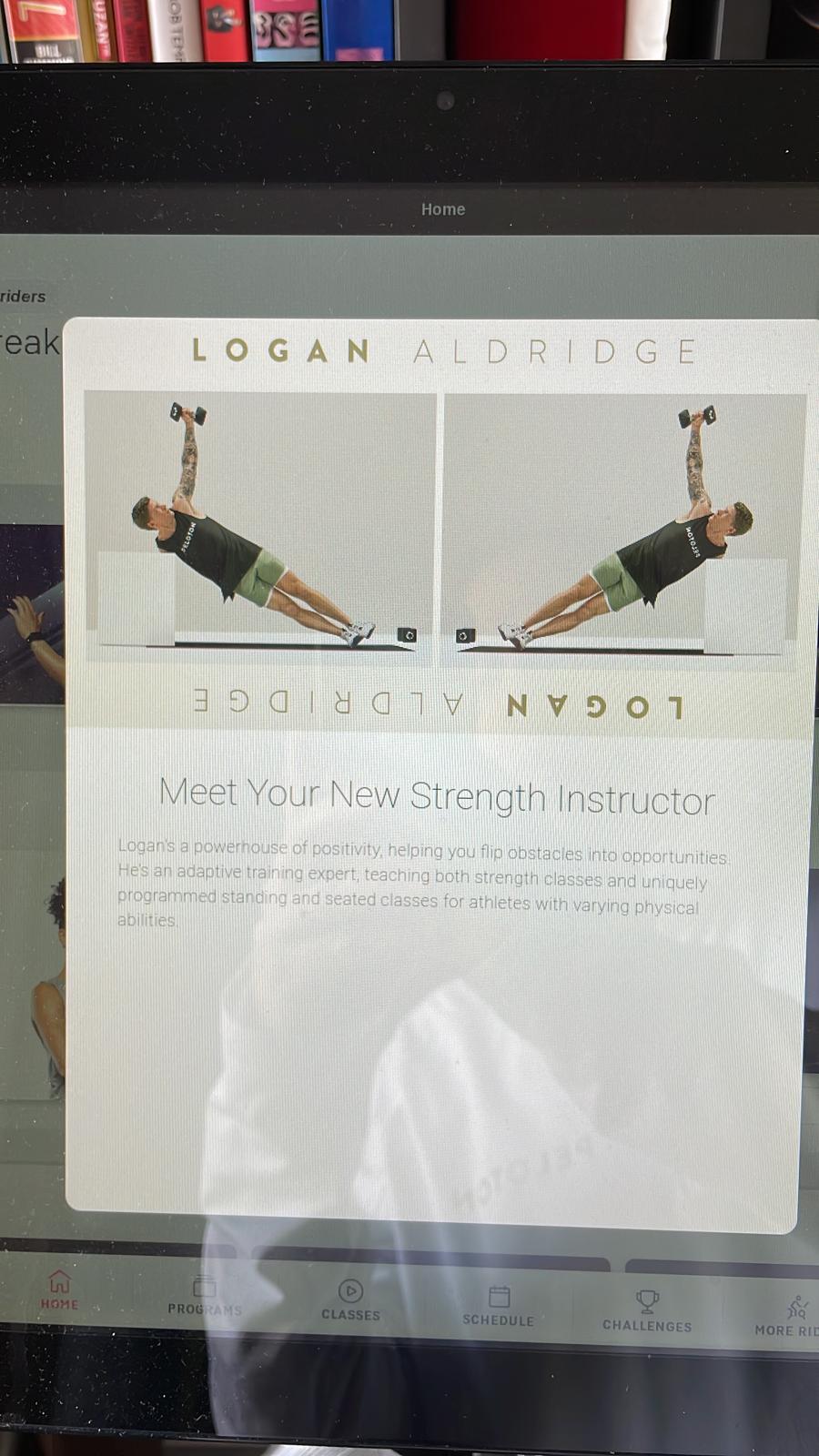 Pop-up notification announcing Logan Aldridge on Peloton Bike.
