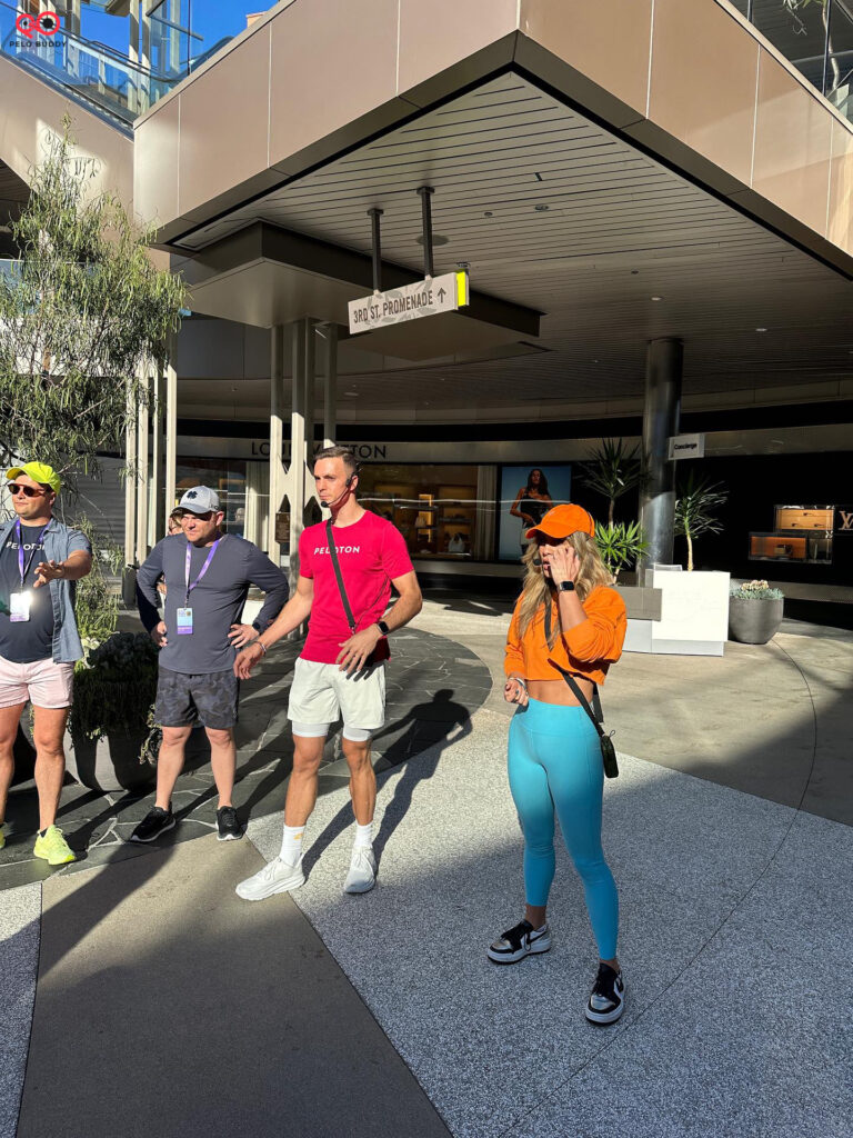 Kendall Toole & Ben Alldis greeting the group to start one of the Peloton Outdoor Walk & Talk during Peloton on Tour in Los Angeles.