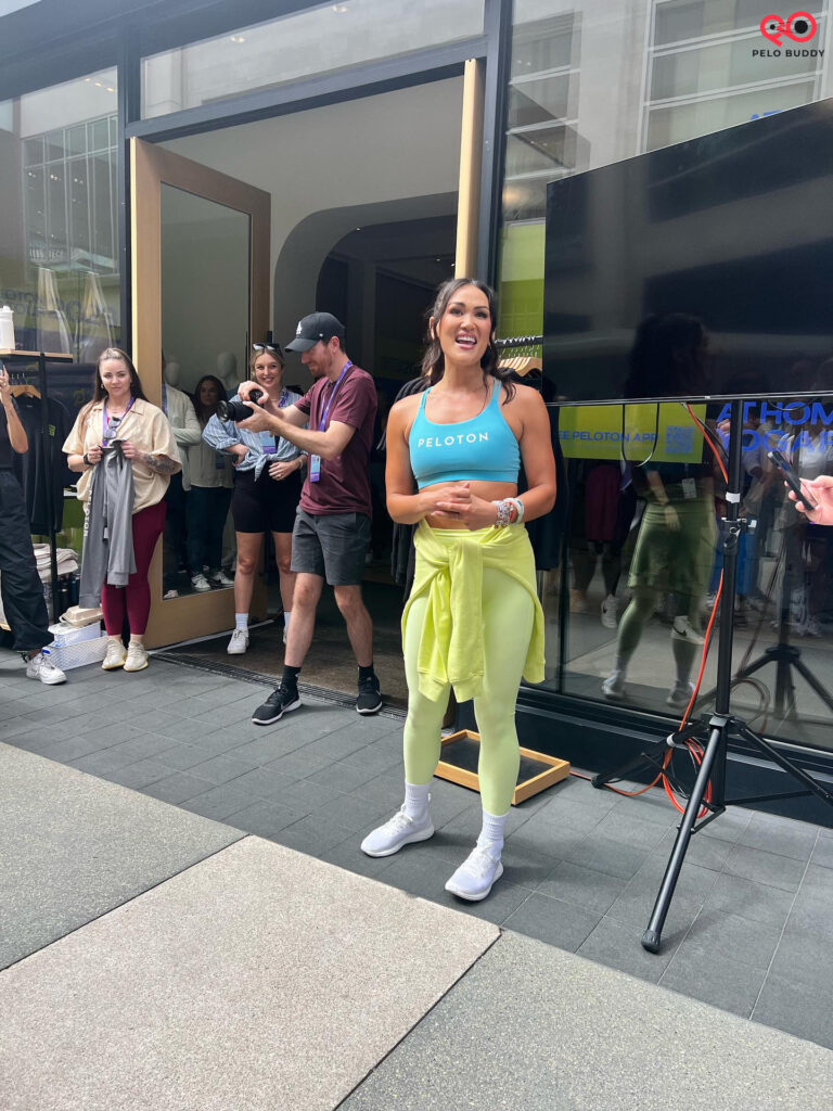 Katie coming outside to say hello to the high five crew before starting class at Peloton On Tour.