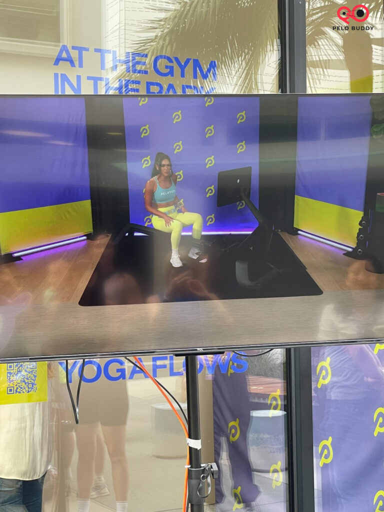 One of the TVs set up outside the showroom for the high five crew to watch the class taping during Peloton on Tour.