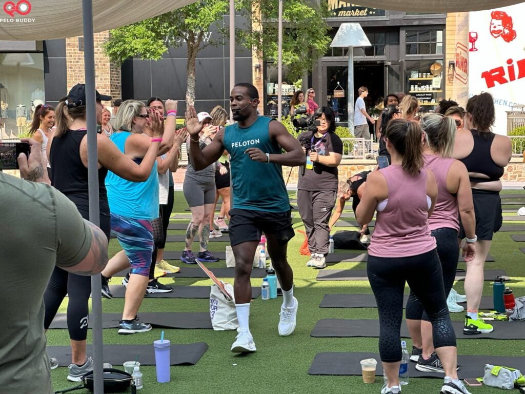 Alex Toussaint welcoming people to his outdoor group class.