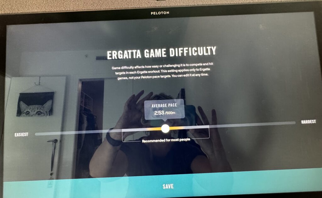 Setting the difficulty level on an Ergatta video game on Peloton Row.