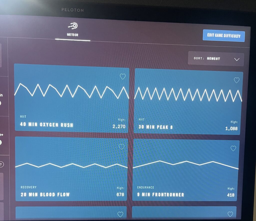 Picking different Ergatta Meteor workouts on Peloton Row.