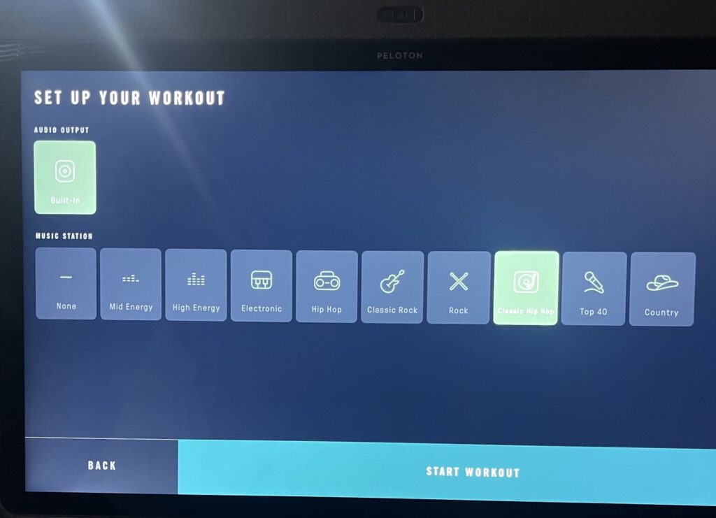 Picking the style of music you want to listen to while playing an Ergatta video game on Peloton Row.
