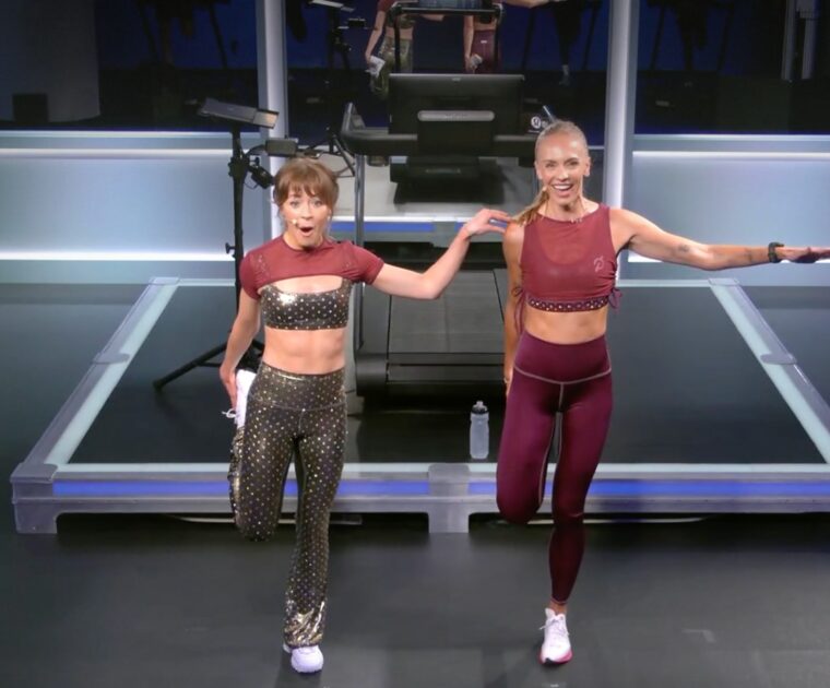 Lindsey Stirling doing the post-class stretch with Becs Gentry.