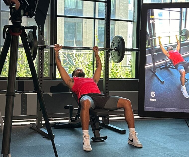 Image included in recent Peloton press release showing Rad Lopez using a barbell.