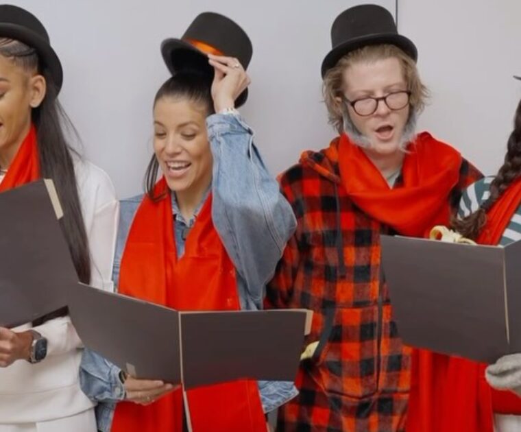 Peloton Instagram post showcasing instructors caroling for the holiday season.