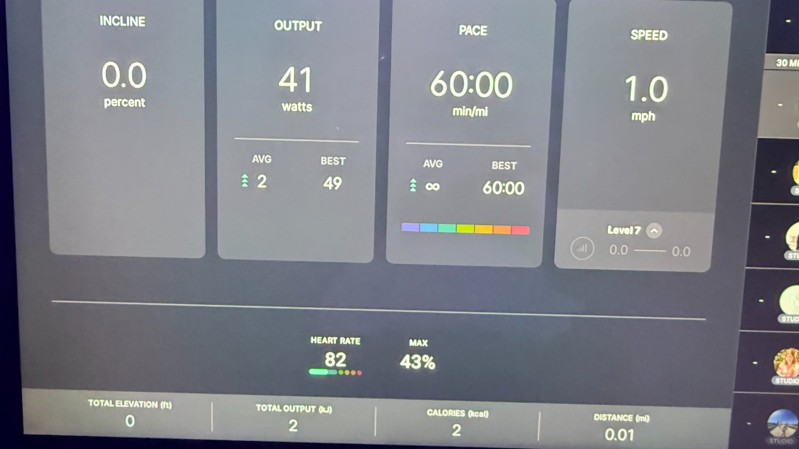Heart rate monitor on a Peloton Tread class in studio with an Apple Watch.