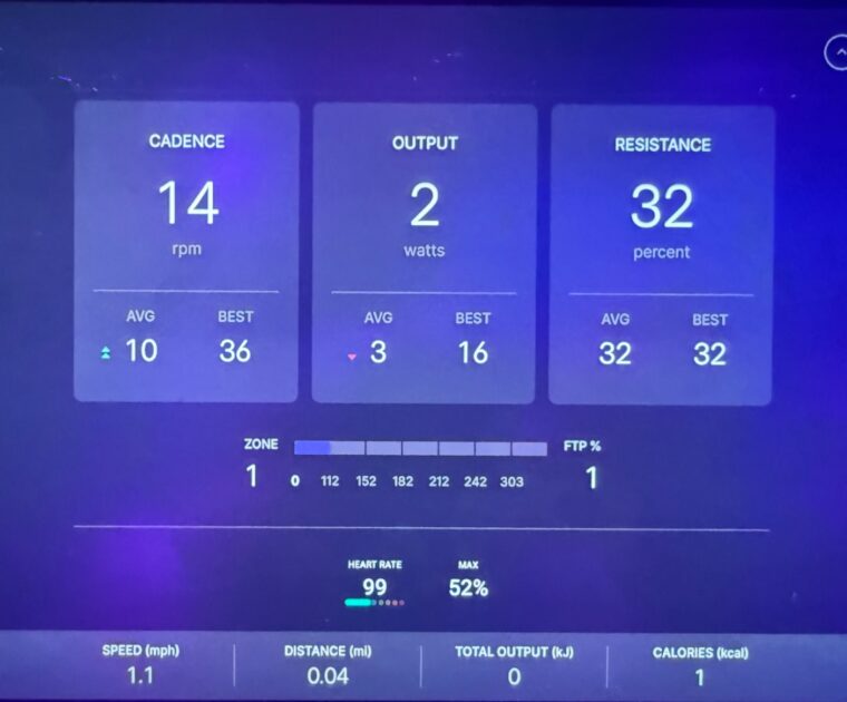 Heart rate monitor on a Peloton Bike class in studio with an Apple Watch.