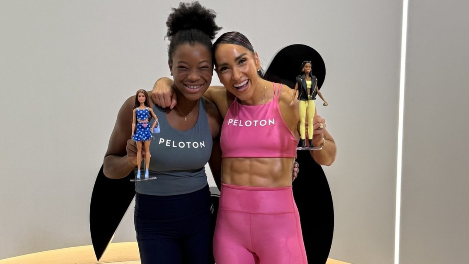 Robin Arzon and her custom Barbie at Peloton.