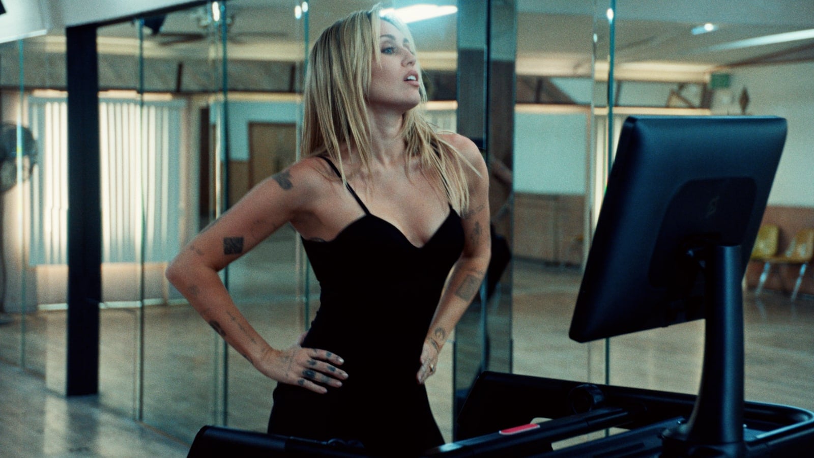 Miley in a Peloton advertising campaign for the Peloton Flex treadmill